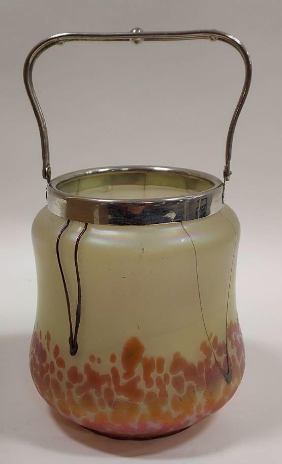 Austrian Pallme Konig Art Glass Ice Bucket: Beautiful art glass ice bucket by Austrian artist Pallme Konig. The ice bucket features a iridescent light gold finish with a red and burgandy abstract design . It measures approx. 5-3/4" tall x 6" ac