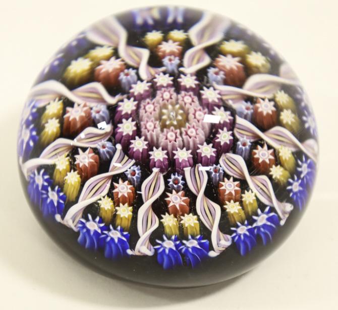 Perthshire Millefiori & Ribbon Paperweight: Beautiful Perthshire Scotland millefiori & ribbon paperweight. The paperweight measures 2-1/2" in diameter and is in great condition. The center cane is marked with the "P" and the base has a paper la