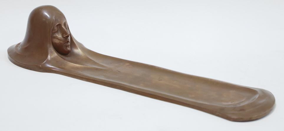 Copper Art Nouveau Woman's Head Pen Rest: Attractive antique Art Nouveau cooper pen rest featuring a sleeping woman's head. The rest measures 14-1/2" across x 4" deep x 3" tall. Nice condition and marked 3778 on the base.