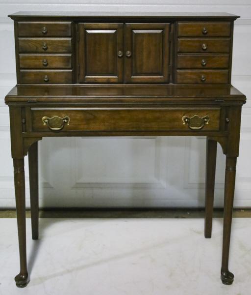 Pennsylvania House Flip Top Stepback Desk: Vintage Pennsylvania House flip top stepback secretary desk. Features nine drawers and interior cubby for paperwork storage. Fitted with brass hardware and pad feet. Overall good condition with wear f