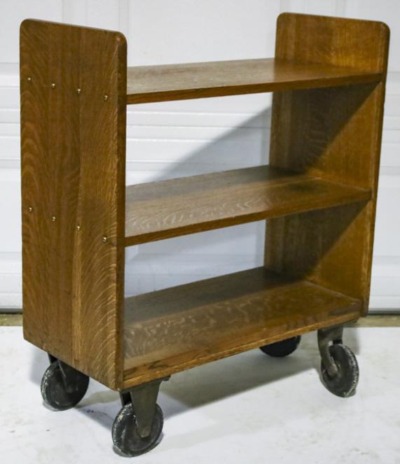 Vintage Industrial Wood Rolling Bookcase: Vintage industrial wood rolling bookcase. Overall good condition with wear from use and age. Measures approximately 36" tall by 30" across by 14" wide.