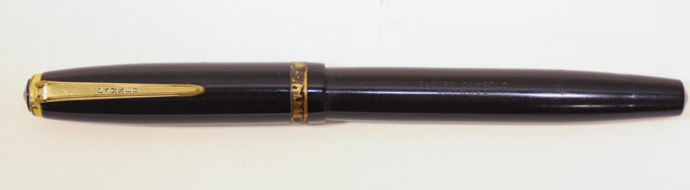 Vintage Parker Duofold Fountain Pen: Vintage black Parker Duofold fountain pen. The pen is in nice condition with use wear. Measures 5-1/8" long overall.