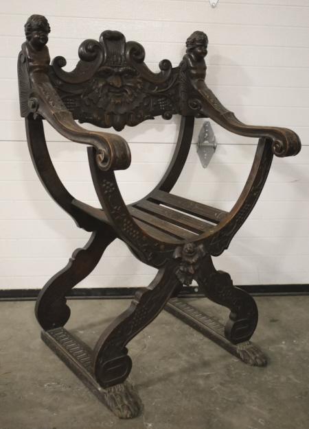 Katharine Hepburn Movie North Wind Face Chair: According to the seller this chair was used by Katharine Hepburn in the movie "Mary of Scotland" in 1936. 1900's carved wood north wind face savanarola chair. Displays well with carved faces and claw
