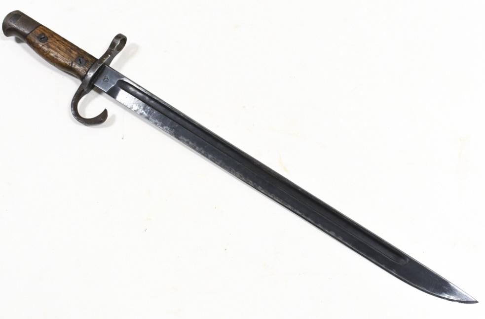 WWII Japanese Tokyo Arsenal Bayonet: WWII Japanese military Tokyo Arsenal bayonet. Appears to be in good condition with some knicks on blade edge and wear from use and age. Overall it measures approximately 20-1/4" across. Blade measures