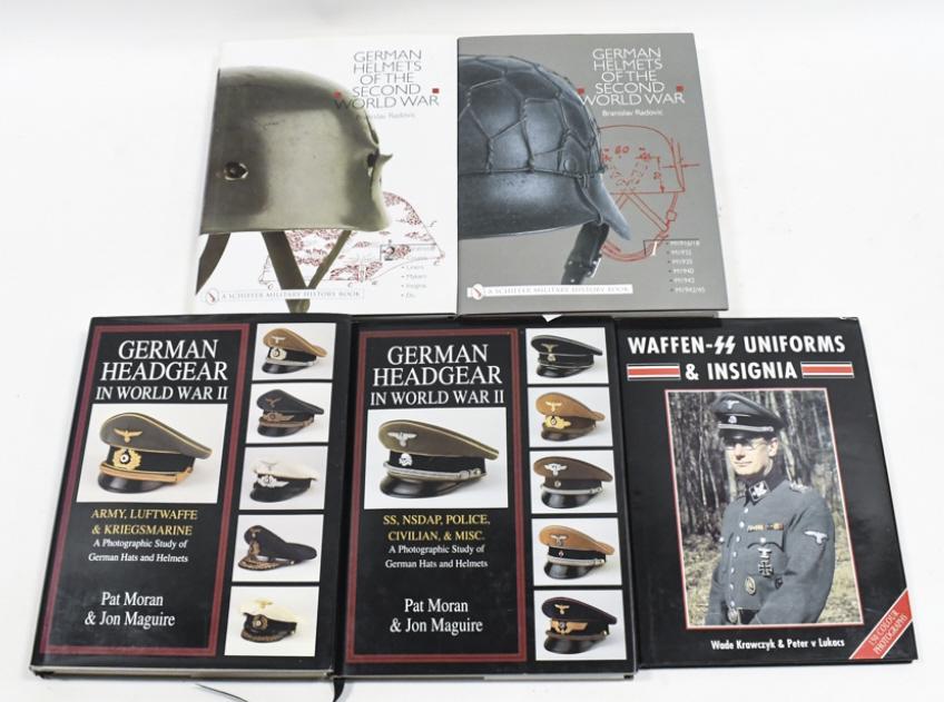 (5) WWII German Uniform Collector's Guide Books: Lot of five high quality WWII German uniform collector's guide hardback books. Lot includes Branislav Radovic's "German Helmets Of The Second World War" two book set, Pat Moran's & Jon Maguire's "Germ
