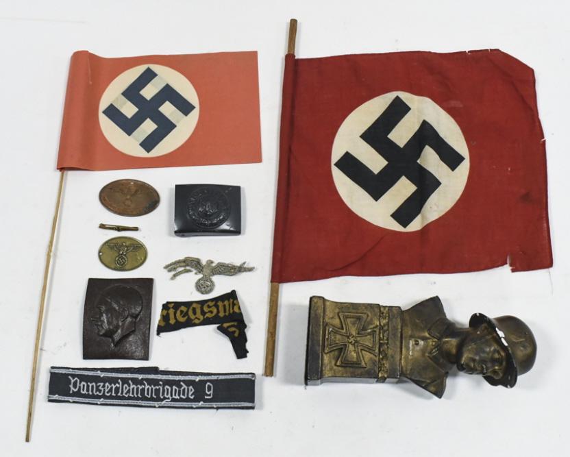 Collection Of WWII German Third Reich Artifacts: Unique grouping of WWII German Third Reich artifacts. Lot includes two parade flags (one is cloth and the other is paper), military belt buckle, Mit Gott pin, Adolf Hitler plaque, German soldier desk 