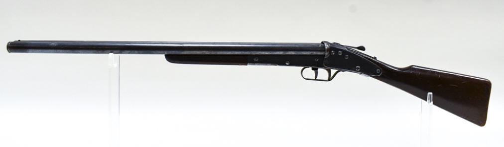 Daisy Model 104 Double Barrel Air / BB Gun: Early Daisy model no. 104 double barrel bb gun. Original condition with plate loss and and wear from use and age. Wood stock does have a crack. Untested. Displays well with engravings on receiver. Ove