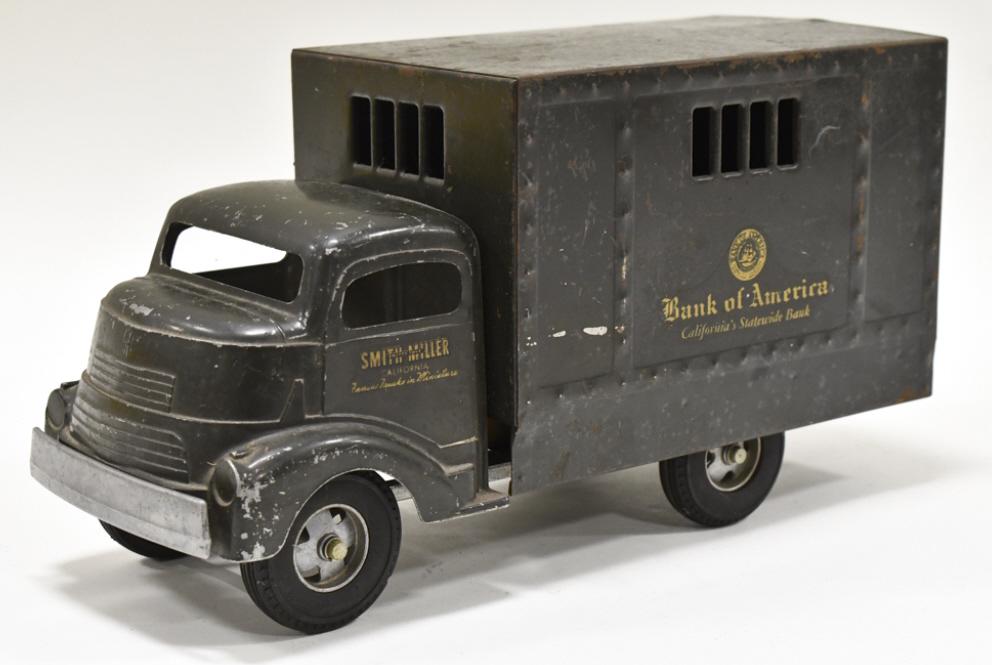 Original Smith Miller GMC Bank Of America Truck: Original Smith Miller GMC Bank of America armored delivery truck. The truck has expected paint loss and wear from age. Displays well with a good look. Measures approximately 14" long.