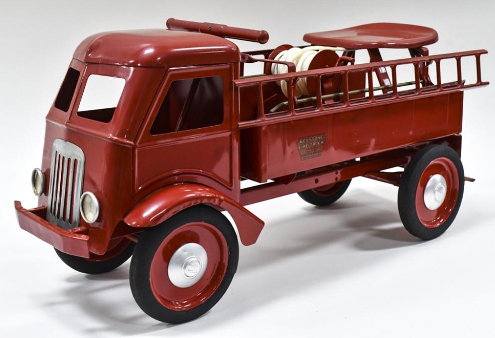 Restored Keystone Ride 'Em Fire Ladder Truck: Restored Keystone ride 'em fire ladder truck. The truck displays well with ladders, hose reel, and Keystone hubcaps. Good condition with some paint chips and light wear from age. Measures approximatel