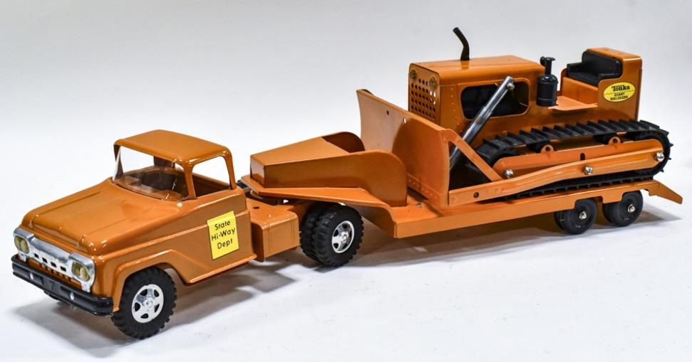Restored Tonka State Hi-Way Dept Lowboy w Dozer: Restored Tonka State Hi-Way Dept. truck with lowboy and Tonka Giant Bulldozer. Displays well with a nice paint job. Good condition with light wear from storage and display. Measures approximately 26"