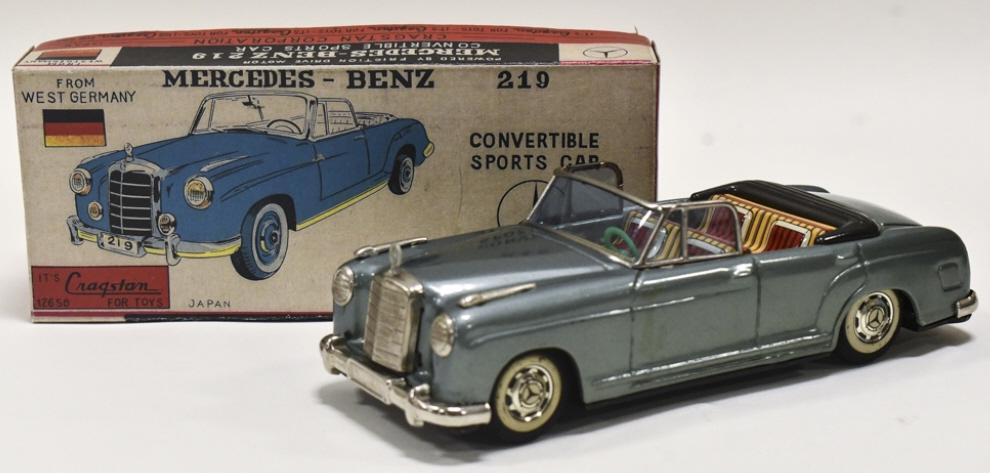 Bandai Tin Friction Mercedes-Benz 219 Convertible: Cragstan / Bandai tin friction Mercedes-Benz 219 convertible. Comes with a reproduction box. The friction works. Displays well with great colors, and the hood ornament. Good condition with some scuffs