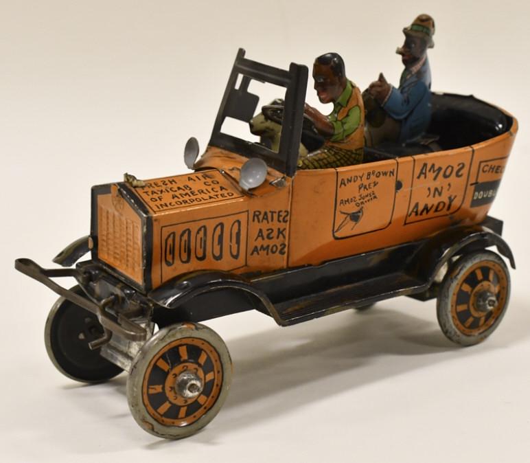 Marx Tin Windup Amos 'N' Andy Fresh Air Taxi: Marx tin litho windup Amos 'N' Andy fresh air taxi. The windup mechanism works sometimes, but does need help. The taxi has some paint loss and fading from age and play. Displays well with good graphic