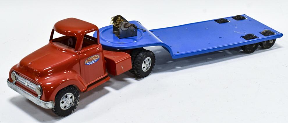 Restored Tonka Truck With Lowboy Trailer: Restored Tonka round fender truck with lowboy trailer. The trailer has some scratches. Good condition with some wear from storage and display. Measures approximately 25-1/2" long.