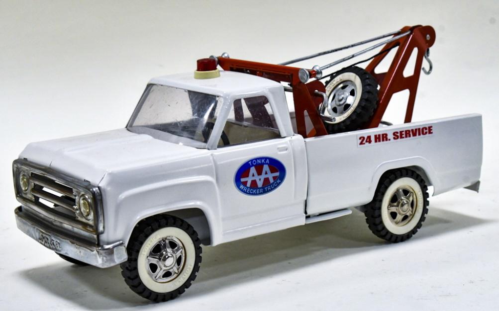 Restored Tonka AA Wrecker 24 HR. Service Tow Truck: Restored Tonka AA wrecker 24 hour service tow truck. Good condition with a couple paint chips and light wear from storage and display. Measures approximately 14" long.