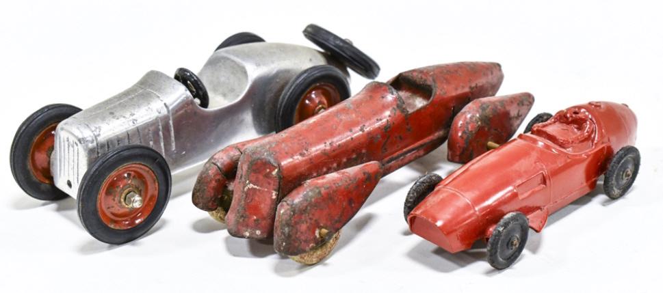 Wyandotte, Tootsietoy, & Other Racers: Lot includes a Wyandotte streamline boat tail racer, Tootsietoy racer that is missing the drivers head, and an unmarked racer car. Largest measures approximately 6-1/2" long.