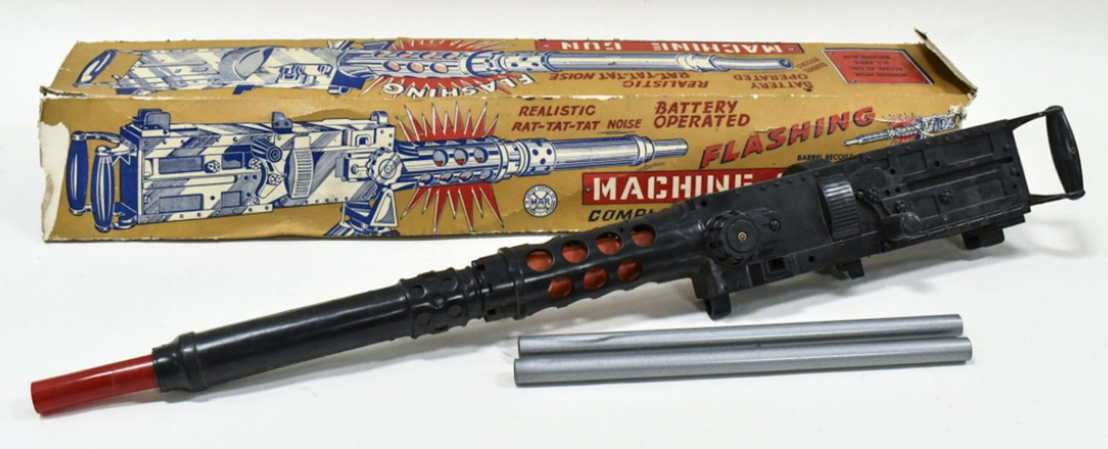 Marx Battery Op. Flashing Machine Gun w/ Box: Marx battery operated flashing machine gun. It is missing one leg for the tripod and the piece that mounts the tripod to the gun. The box is missing end flaps and has wear from storage and age. Measur