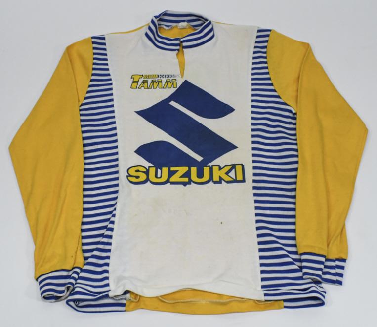 1980s Team Tamm Suzuki Motocross Racing Jersey: Original 1980s Team Tamm Suzuki professional motocross racing jersey. Jersey is in overall good condition with discoloration and wear from use and age. Has a modified collar. Made from 50/50 cotton &