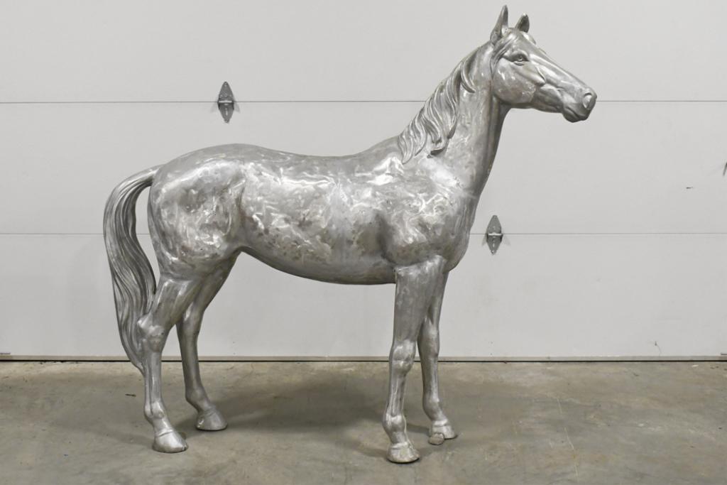 Life Size Cast Aluminum Horse Statue: Unique life size cast alminum horse statue. Statue appears to be in good condition. It has grinder marks, but these are believed to be original. It measures approximately 71" across by 65" tall.