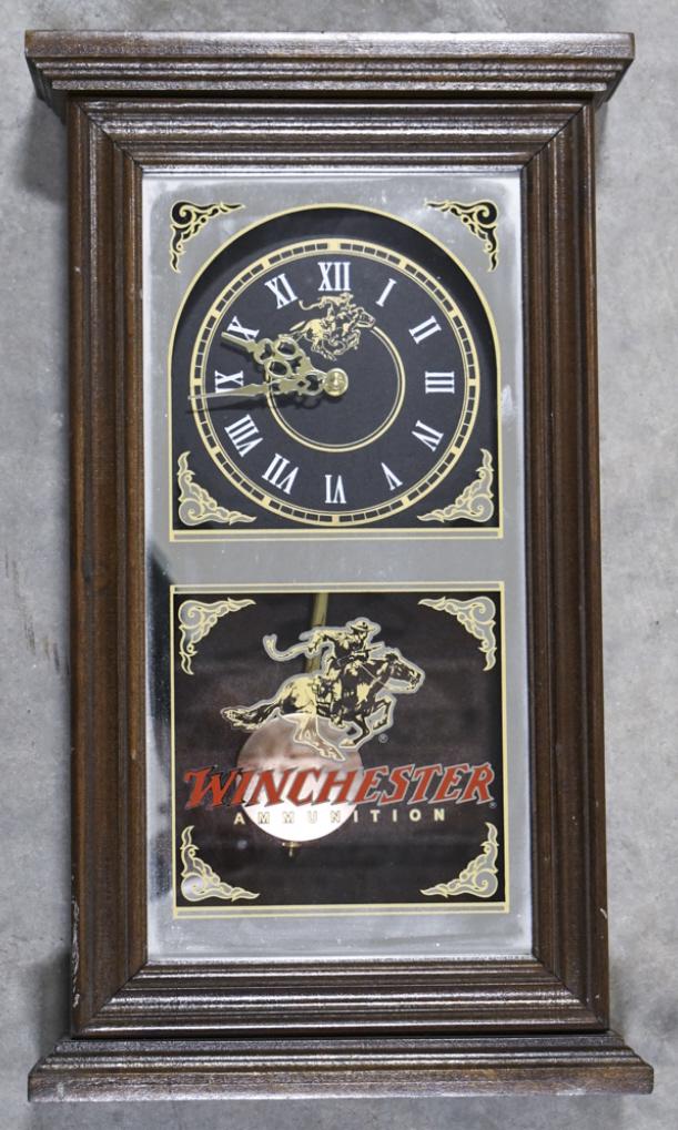 Winchester Ammunition Advertising Wall Clock: Unique Winchester Ammunition advertising wall / tabletop clock. Clock features a battery operated movement, wood case, and mirrored glass face. It is in good condition with som e scuffs and wear from 
