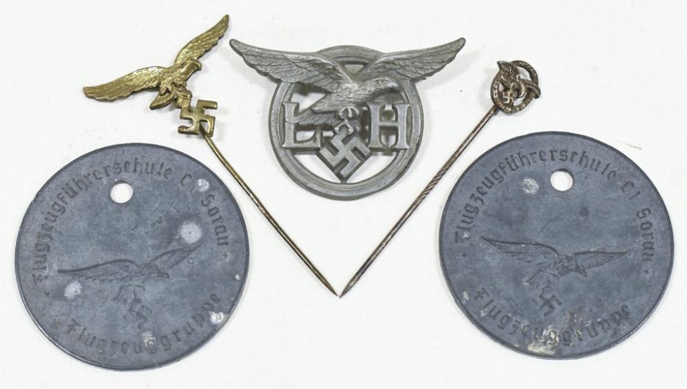 WWII German Luftwaffe Pins / Badge & More: Lot of WWII German Luftwaffe stick pins and more. Lot includes two Luftwaffe stick pins, a Luftwaffe Flak Helper badge, and (2) Luftwaffe pilot school medals. Items vary ion age nad condition. They di