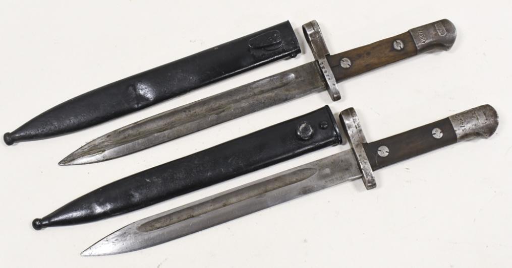 (2) Turkish M1935 Bayonet w M1 Garand Modification: Lot of two Turkish M1935 bayonets with M1 Garand modifications and scabbards. Both are in fair condition with surface rust , nicks on edge of blade, and wear from use and age. Largest approximately 14