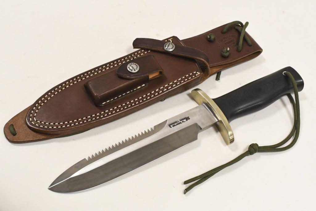 Randall Made Model 14 Attack Fixed Blade Knife: Randall Made fixed blade model 14 " Attack " knife with Micarta handle, sawtooth edge, forward cuved brass hilt, and leather sheath. Appears to be in very nice condition with light wear from display a
