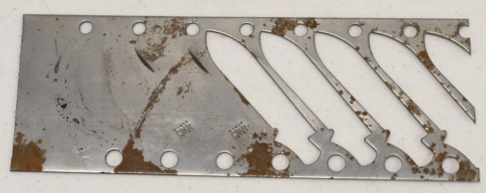 Uncut Case XX Folding Knife Blade Sheet: Unique original Case XX factory uncut folding knife blade sheet. Sheet features 4 cut out blades and 2 uncut blade. Sheet has some surface rust from storage and display. Overall it measures approximat