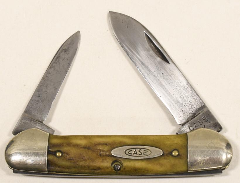 1940-64 Case XX Canoe 52131 Folding Knife: 1940-1964 Case XX Canoe model no. 52131 folding knife. Knife appears to be in fair condition with some pitting on blade and wear from use and age. When closed it measures approximately 3-5/8" across.