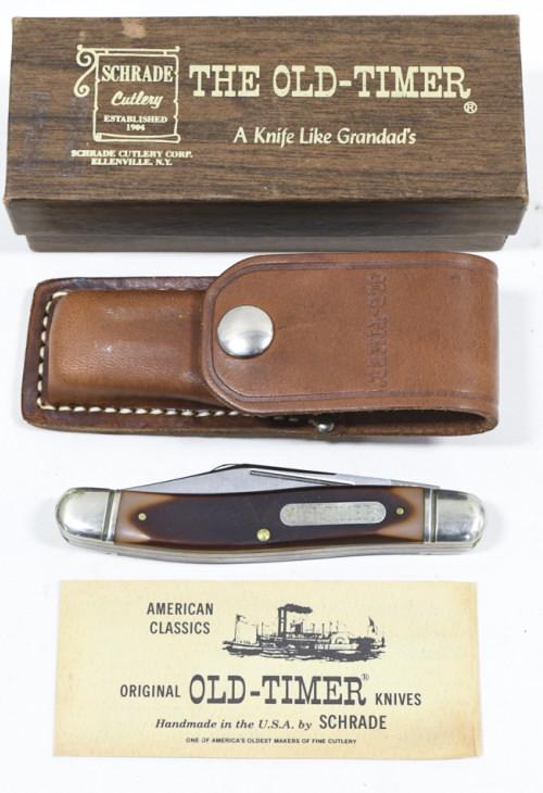 Vintage Schrade Old Timer 858OT Folding Knife: Vintage Schrade Old Timer model no. 858OT folding knife in original box with paperwork and leather sheath. Knife appears to be in good condition with some plate loss and wear from use, age, and storag