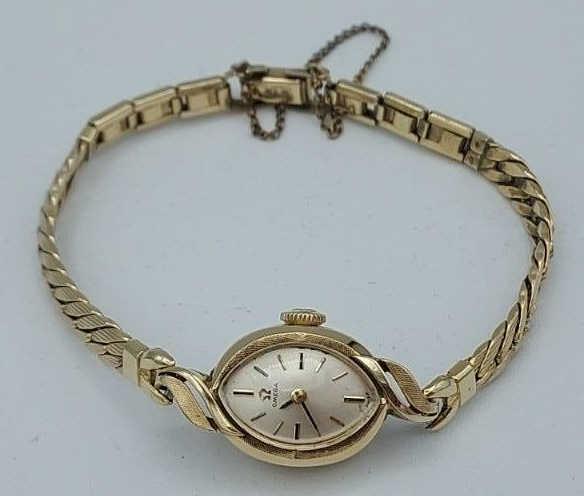Ladies 14K Yellow Gold Omega Wristwatch: Ladies 14K yellow gold Omega wristwatch. Case is marked 14K with a 10K Gold Filled bracelet band. Total weight with band 13.9 grams.