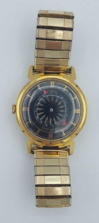 Vintage Ernest Borel Kaleidoscope Wristwatch: Vintage Ernest Borel Swiss Kaleidoscope face wristwatch. Gold tone stretch Speidel band. Exhibition back, in working condition.