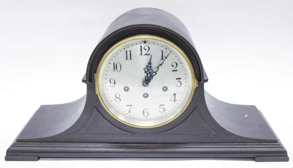 Antique Seth Thomas Wood Mantel Clock: Antique Seth Thomas Wood mantel clock. Made in USA. With pendulum. Measures 20" across, 10" tall, 7" deep.