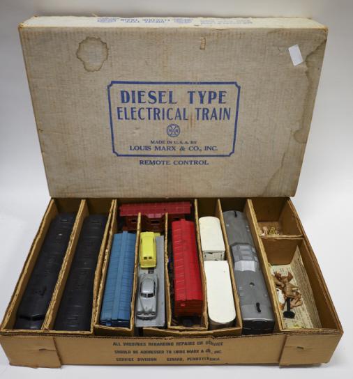 Marx Deisel Tyle Electric Train Set: Lot includes, Marx Rock Island Number 99 engine, Rock Island B Unit, Auto Carrier Car, Caboose, Flat Car with van tarilers, and more. Comes with number 44564 box, Box does not match set.