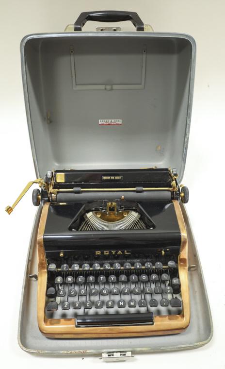 Royal Quiet De Lux Gold Plated Typewriter in Case: Vintage Royal Quiet De Lux Gold Plated Typewriter in case. Typewriter is in nice, clean condition. Some wear from use and age. Royal decal on back side. Kanak & Sons Case has wear from use and age.