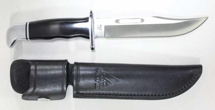 Buck Knife Special #119 Fixed Blade & Sheath: Buck Knife Special #119 Black Phenolic handle, fixed blade and 119 leather sheath. Nice condition with minor wear. Blade measures 6" long, overall length 10.5" long,