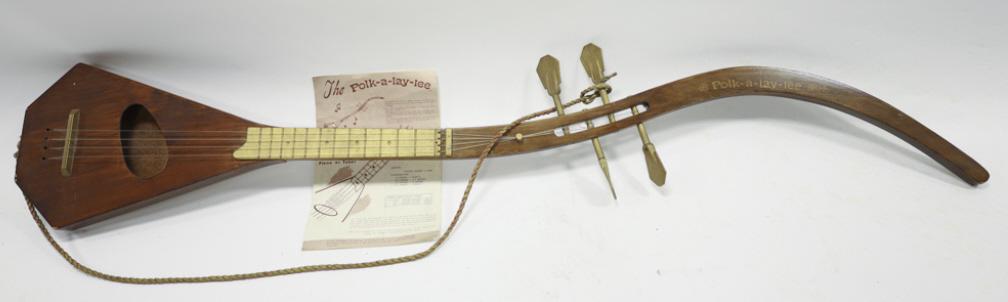 1960s Vintage Polk-A-Lay-Lee By Petersen Prod.: Vintage 1960s Polk-A-Lay-Lee by PetersenÊ Productions. Comes with original music andÊ instrucion booklet. Marked "Polk-A-Lay-Lee"Ê on neck. Wall hangers mounted on the back.Ê Measures 50.5" long, 