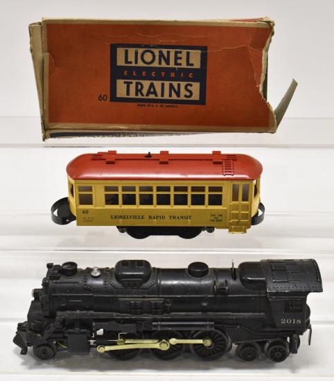 Lionel #2018 Engine & #60 Lionelville Trolley: Lionel #2018 engine and #60 Lionelville Rapid Transit Trolley with box. The trolley box is missing some end flaps. The trolley and engine have wear from use and age.