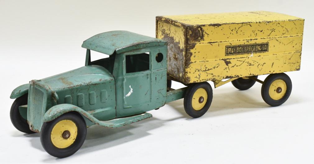 Steelcraft Playboy Trucking Co. Truck & Trailer: Original Steelcraft Playboy trucking co. truck and trailer. The trailer is missing the rear doors, and the truck is missing the headlights. Overall has paint loss and wear from play and age. Displays 
