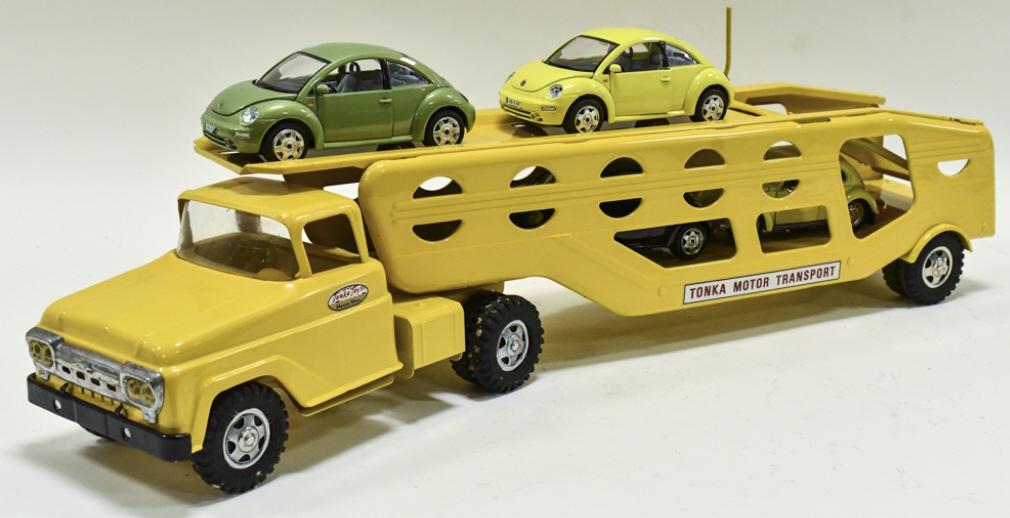 Restored Tonka Motor Transport Car Carrier w/ Cars: Restored Tonka Motor Transport car carrier with load of 1/24 scale Volkswagen cars. The truck has a couple chips and light wear from storage and display. Measures approximately 26" long.