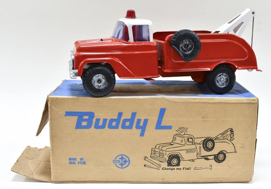 Buddy L No. 5427 Flat Tire Wrecker Truck With Box: Original Buddy L no. 5427 flat tire wrecker truck in the original box. The truck is in good condition with a scratch to the paint by the siren. The box has some pealing to the top and wear around the 