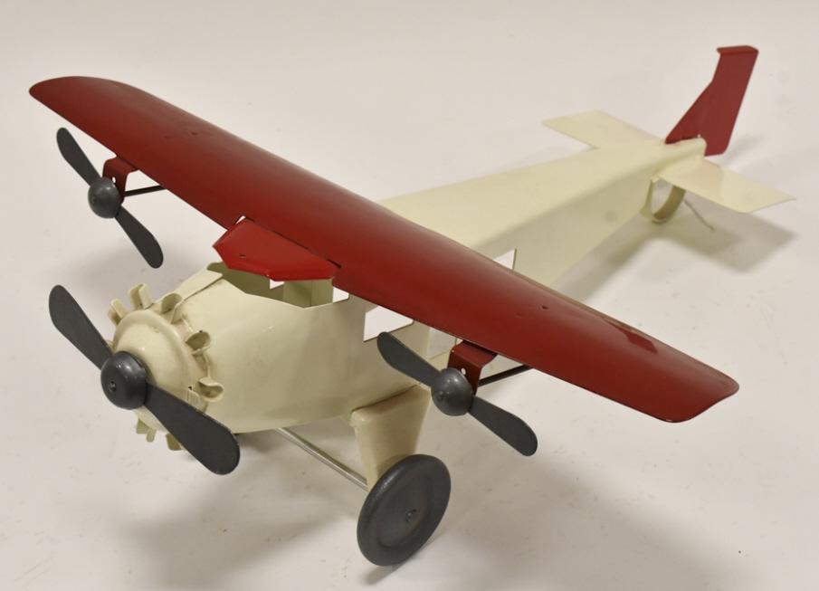 Restored Turner Toys Tri-Prop Airplane: Restored Turner Toys tri-prop airplane. The plane has dust and wear from storage and display. Displays well with a nice restoration. The wingspan measures approximately 18" long.