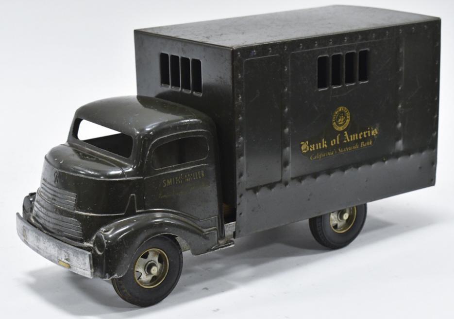 Original Smith Miller GMC Bank Of America Truck: Original Smith Miller GMC Bank of America armored delivery truck. The truck has expected paint loss and wear from age. Displays well with a good look. Measures approximately 14" long.