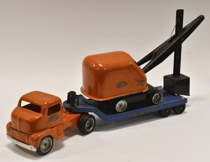 Original Tonka Truck w/ Carry-All Trailer & Shovel: Original Tonka cabover truck with no. 130 carry-all trailer with steam shovel. Overall good condition with paint loss and wear from play and age. It is missing the ramps for the trailer. Measures appr