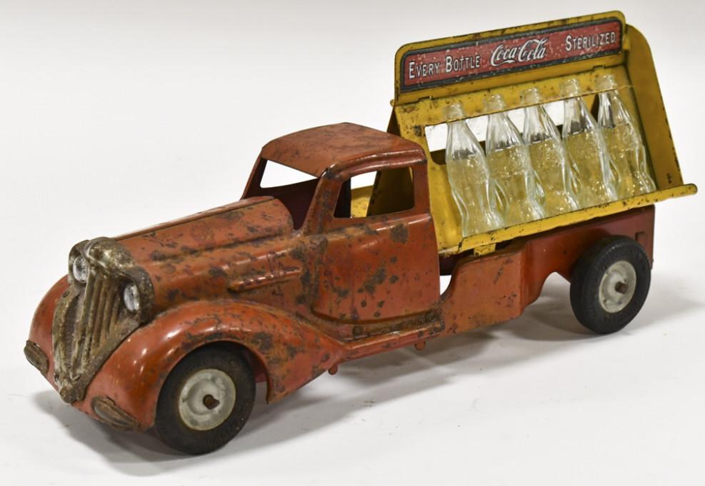 Metalcraft Coca-Cola Bottle Delivery Truck: Metalcraft Coca-Cola bottle delivery truck. The decals on the truck are not original. Displays well with sweetheart, headlights, and Silvertown Goodrich tires. The truck has paint loss and wear from p