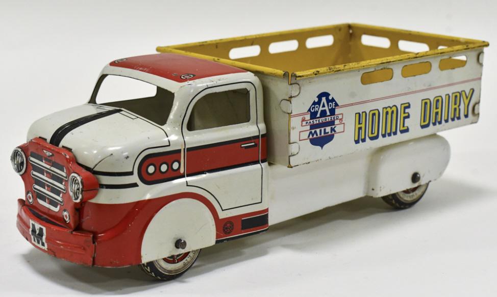 Marx Home Dairy Milk Delivery Truck: Marx Home Dairy Grade A Milk delivery truck. Displays well with good colors. The truck has chips and wear from play and age. Measures approximately 14-1/2" long.