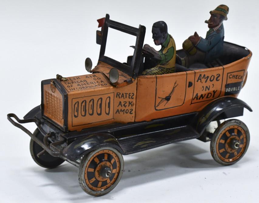 Marx Tin Windup Amos 'N' Andy Fresh Air Taxi: Marx tin litho windup Amos 'N' Andy fresh air taxi. The windup mechanism works, but does need help at times. The taxi has some paint loss and fading from age and play. Displays well with good graphics