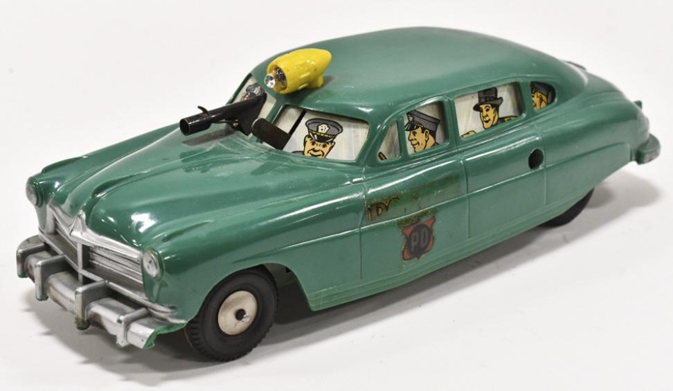 Marx Windup Police Dept. Car w/ Gun & Siren: Marx plastic and tin windup Police Dept car with gun and battery operated siren. The car is missing the key. The siren is untested. The car has wear from age and play. Measures approximately 12-1/2" l