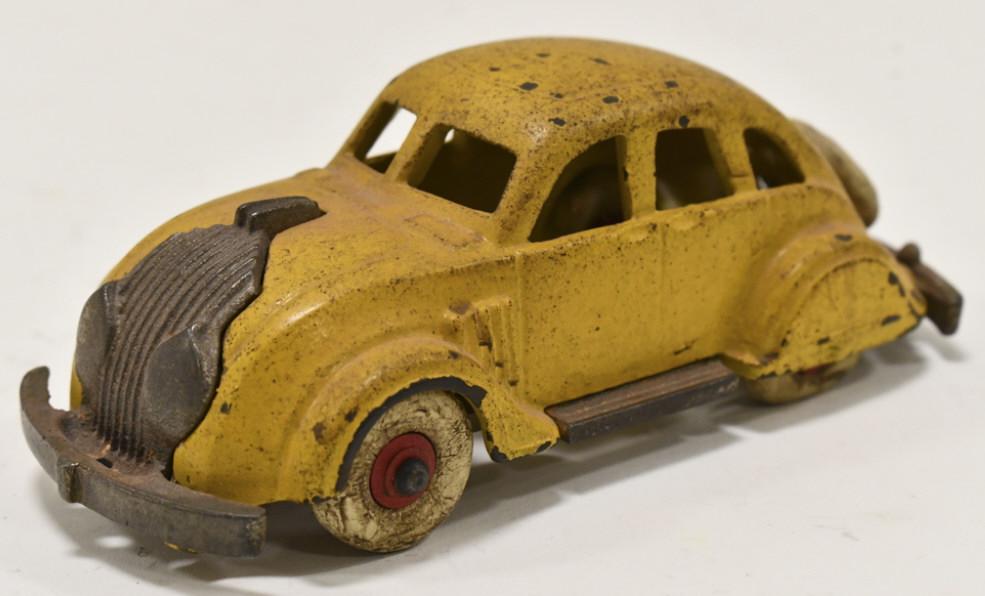 Hubley Cast Iron Chrysler Airflow Car No. 2185: Hubley cast iron Chrysler Airflow car no. 2185. Displays well with spare tire. The car has paint chips and wear from age. Measures approximately 6-1/4" long.