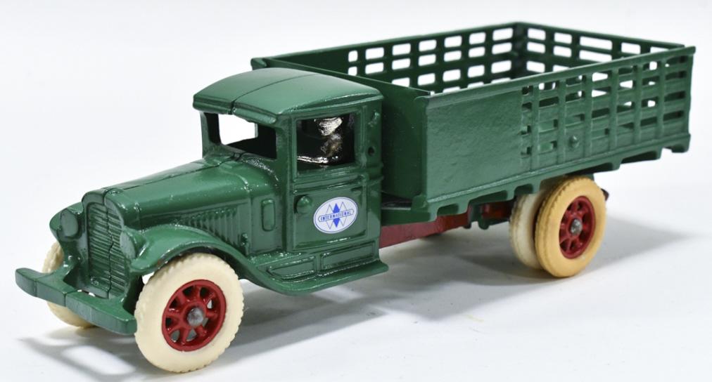 Restored Arcade International Stake Bed Truck: Restored Arcade Internaitonal stake bed truck no. 236. Displays well with International decals on the doors, driver, and a nice restoration. Good condition with light wear from storage and display. Me