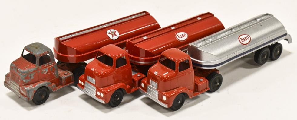 (3) Tootsietoy Esso & Texaco Tanker Trucks: Lot of (3) Tootsietoy Esso and Texaco tanker trucks. The one truck is original. The rest have been repainted. Good condition with paint chips and wear from storage and display. Each measures approxima
